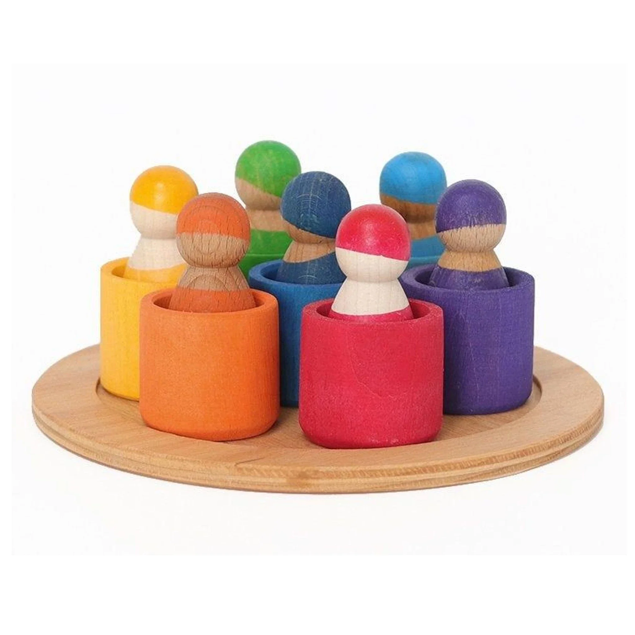 7 houten regenboogpopjes in bakjes